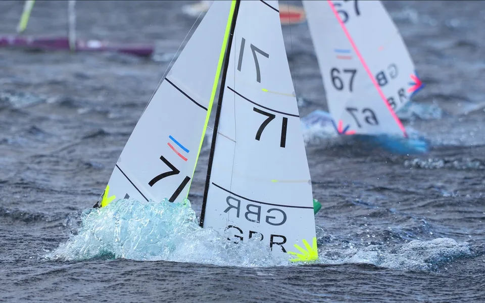 RC racing yachts heeling through spray